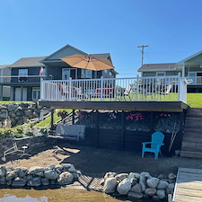 Covered-porch-and-expansive-deck-on-Lake-Somerset-MI 1